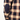 Close-up of a plaid shirt with a patch on a white background