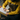 Person in a yellow raincoat holding a cup of coffee outdoors