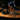Person riding a mountain bike on a dirt trail at night
