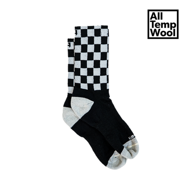 Black and white checkered sock with 'All Temp Wool' branding on a white background