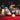 two men playing pool in a bar setting wearing hats