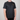 Person wearing a black t-shirt with a logo on a gray background