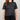 Person wearing a black t-shirt with yellow text on a plain background