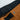 Close up of the inside of the waistband of brown shorts featuring the HANDUP logo