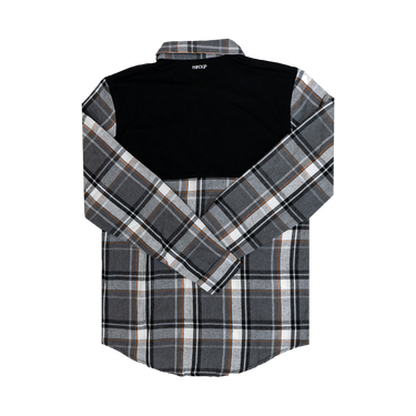 A long-sleeved Flannel Button Up shirt with a checkered pattern in black, gray, and white, featuring a solid black panel across the top shoulders.
